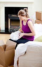 Caucasian woman having a break between boxes