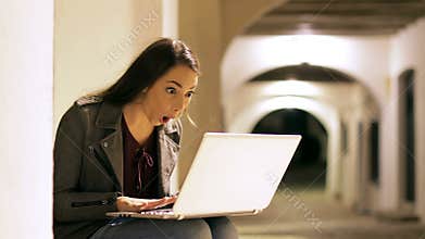 Surprised woman finding online content looks at camera