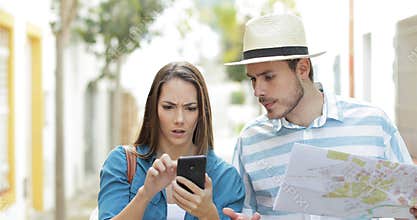 Angry tourists using a spoiled smart phone