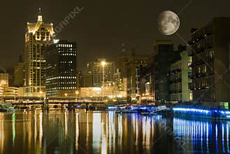 City at night with large moon