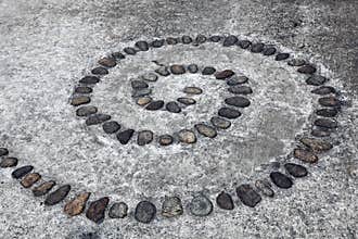 Circular pebble arrangement in gray