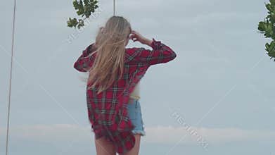 Woman at the beach during cloudy windy day