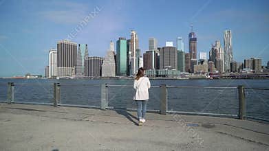 Young woman near Brooklyn bridge