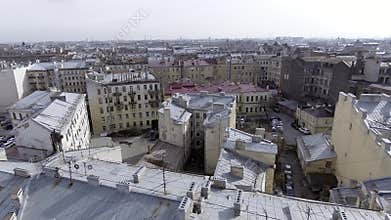 Top view of urban area of big city with buildings, toproofs, streets and cars