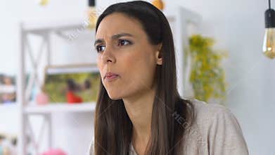 Woman eating salad and feeling unpleasant taste and smell, spoiled food, gmo