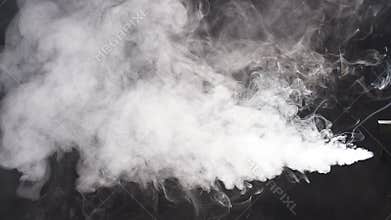 Stream of white smoke on an isolated black studio background