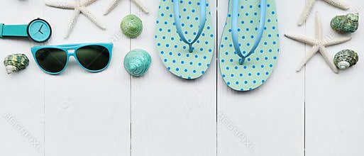 Modern fashionable sunglasses and sandals with starfish