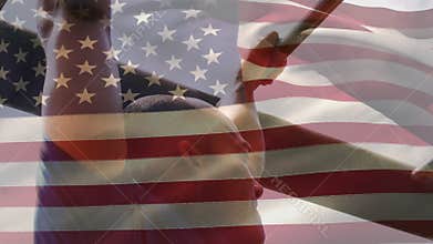 Man on monkey bars and American flag