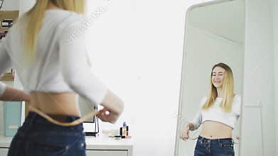 Happy Woman checking success of weight loss program
