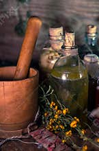 A witchery stuff: multiple tincture bottles, bunches of dry healthy herbs, stack of ancient ritual books, amulets, candles...