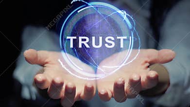 Hands show round hologram Trust
