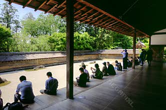 Tourists in Ryoanji zen temple, Kyoto, Japan