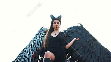 Mighty dark angel descended from heaven, cruel mistress of world gave her soul to the devil and took the side of evil