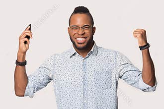 Surprised black man confused by unexpected message on smartphone