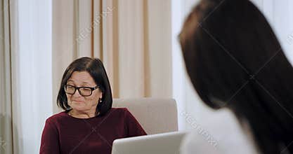 Psychologist old woman have a therapy session with a womna patient witch have a depression, doctor listening very