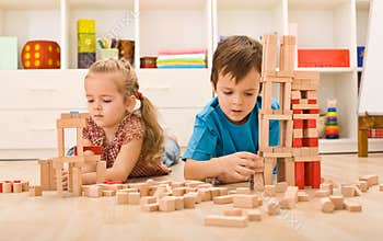 Kids playing with wooden blocks