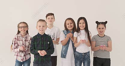 Happy children throwing confetti in air