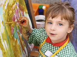 Beautiful school little girl paint watercolors