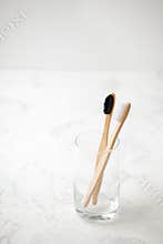 Bamboo teeth brush on minimalistic backgroud. zero waste concept, white background, eco friendly modern simple idea, copy space