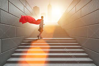 The businessman superhero successful in career ladder concept