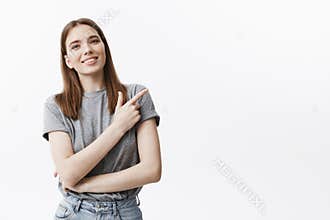 Positive emotions and attitude. Copy space. Good-looking young caucasian brinette student girl with medium hair lenghts