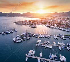 Aerial view of boats, yachts, city at sunset in Marmaris