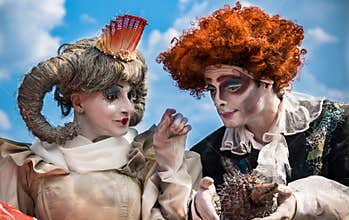 Living human statues actors in costumes