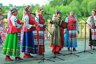 Outdoor performance of women singers wearing ukrainian ethnic traditional clothes and celebrating pagan holiday of Ivan Kupala