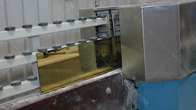 Processing of the edge of the glass with gold coating on the machine tool with program control. Factory for the