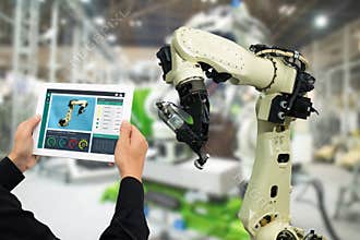 Iot industry 4.0 concept,industrial engineer using software augmented, virtual reality in tablet to monitoring machine in real t