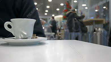 Focus on coffee cup on the table