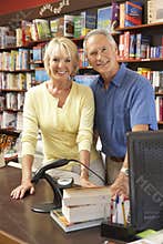 Couple running bookshop