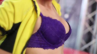 Hot cheerleader demonstrating her body, breasts in camera