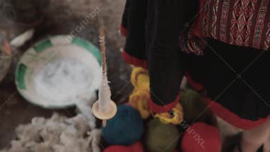 Woman make wool textile. Handmade traditional colorful wool. Peru woman make alpaca textile .