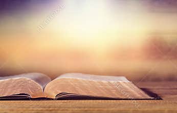 Open Holy bible book on background