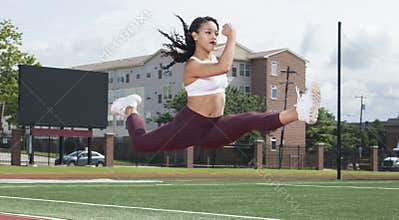 Stunning African-American fitness model on outdoor track