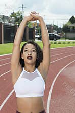 Stunning African-American fitness model on outdoor track