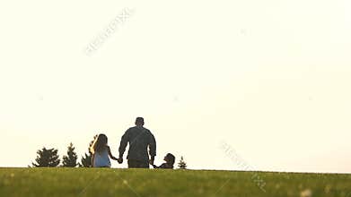 Back view of going military man with two children.