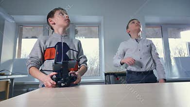 Boys launch and operate drone aircraft. 4K.