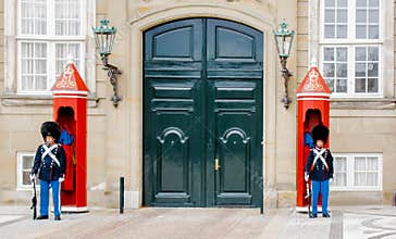 Soldier of the Royal Guard in Amalienborg Castle guarding the entrance in Copenhagen, Denmark