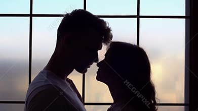 Young couple at home together saint valentine`s day concept dusk desire