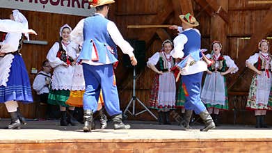 Dancers from Poland in traditional costume perform at one folk festival