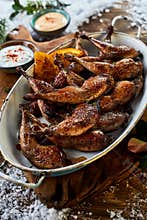 Plate full of spicy barbecued poultry legs