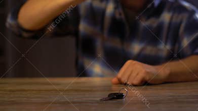 Male driver drinking alcoholic beer at home or bar