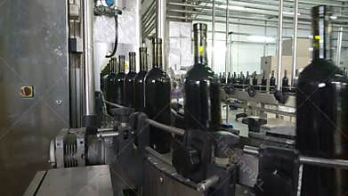 Bottling and sealing conveyor line at winery