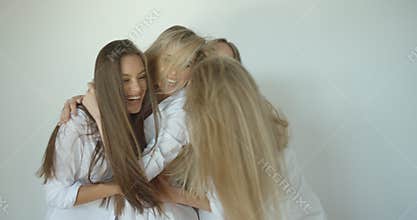 Fast slow motion of four charming smiling attractive girl friends with natural make-up and natural blonde hair happily