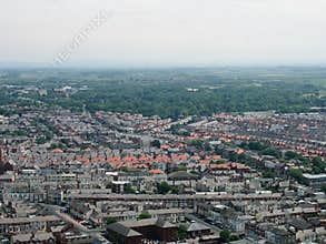 Aerial panoramic view of the town of blackpool looking east showing the streets and roads of the town with lancashire countryside