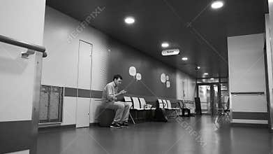 Hospital lobby with patient waiting in room