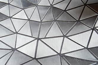 Texture of black carved patterned beautiful triangles with rounded corners and lines. The background.