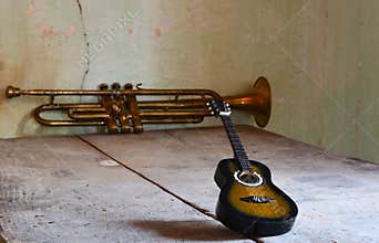 a flamenco guitar and a jazz trumpet